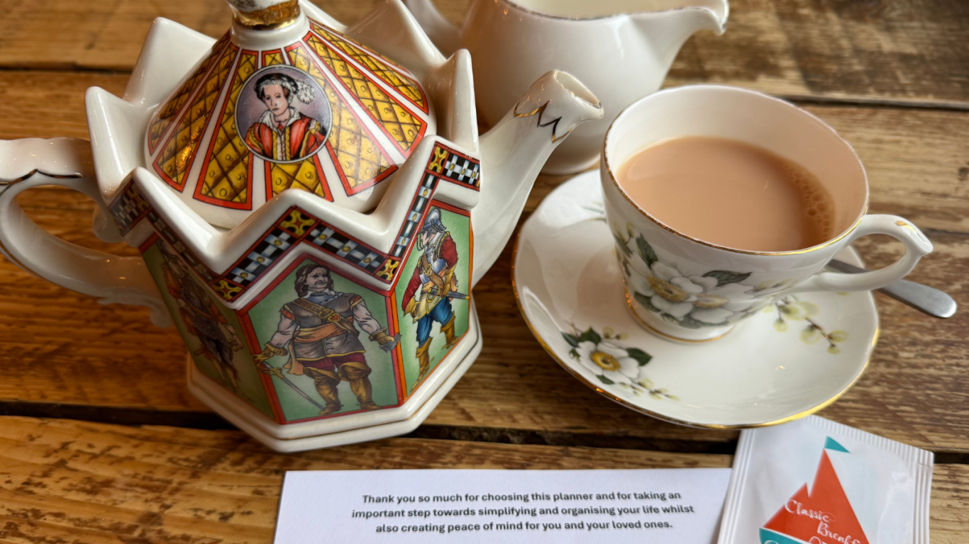 Pour a cuppa and start filling in your planner Image shows an ornate teapot, milk jug and cup of tea along with a welcome note and a complimentary teabag Jayne sends out with her planner